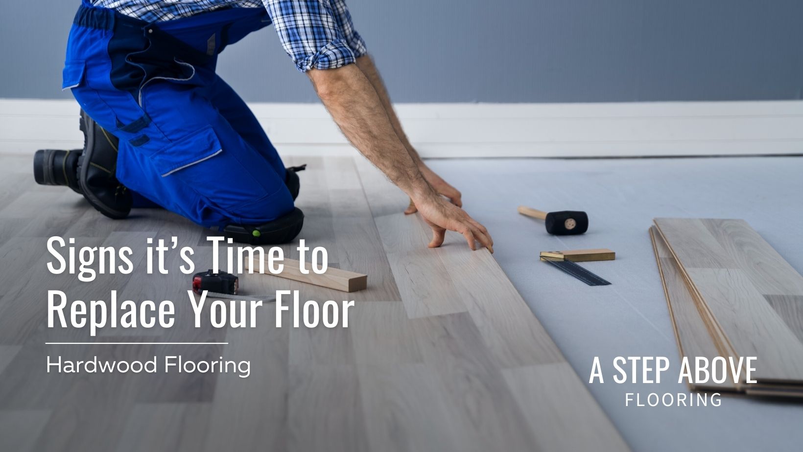 A man installing hardwood flooring